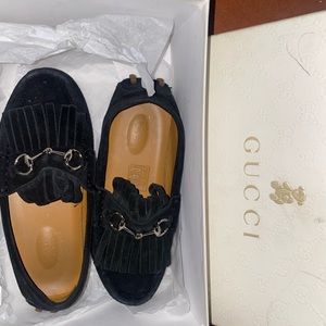 I’m selling kid’s Gucci and Fendi shoes. The condition is good.